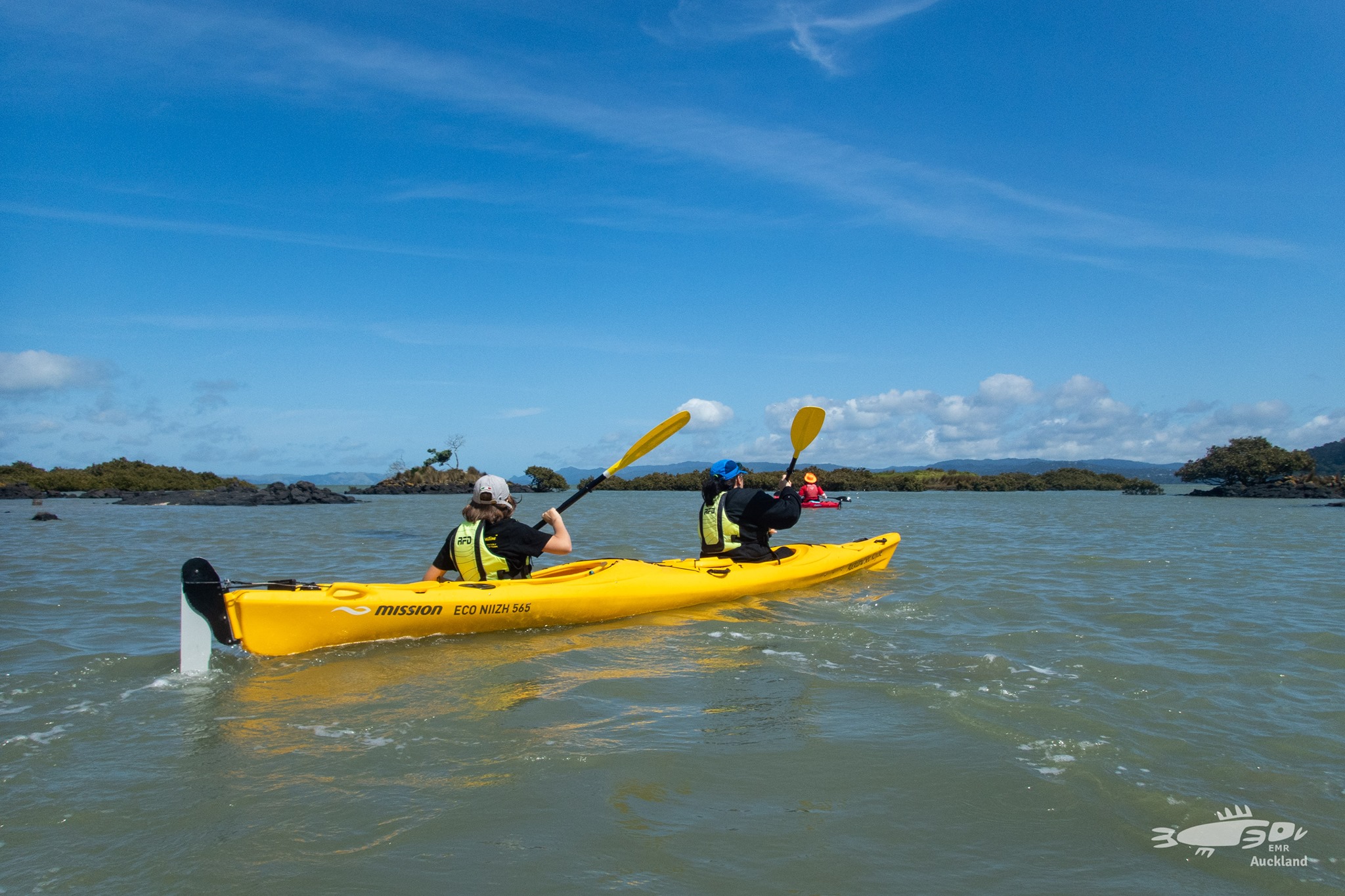 Locals enjoy Manukau Harbour in kayaks